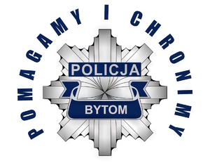Na zdjęciu odznaka policyjna i napis Bytom pomagamy i chronimy